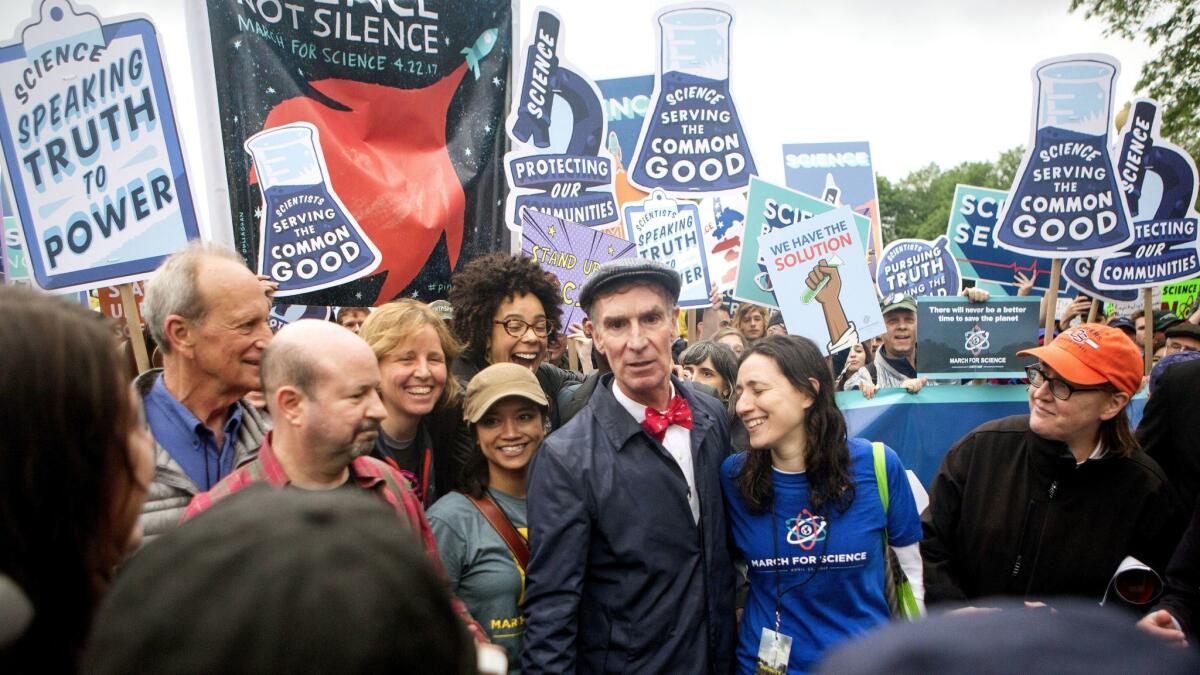 Bill Nye headlined the March for Science in Washington. With him were co-organizers Caroline Weinberg (in the blue shirt) and Ayana Johnson (behind him, with glasses).