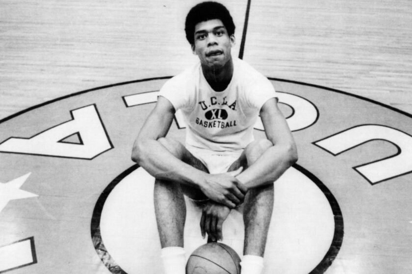February 28 --COLLEGE PLAYER OF THE YEAR-- Lew Alcindor, dominant figure in undergraduate basketball for three years, has been named College Player of the Year by The Associated Press. He sits at center court in UCLA's Pauley Pavilion, where he has never played a losing game in four years. 1969 File photo handout.