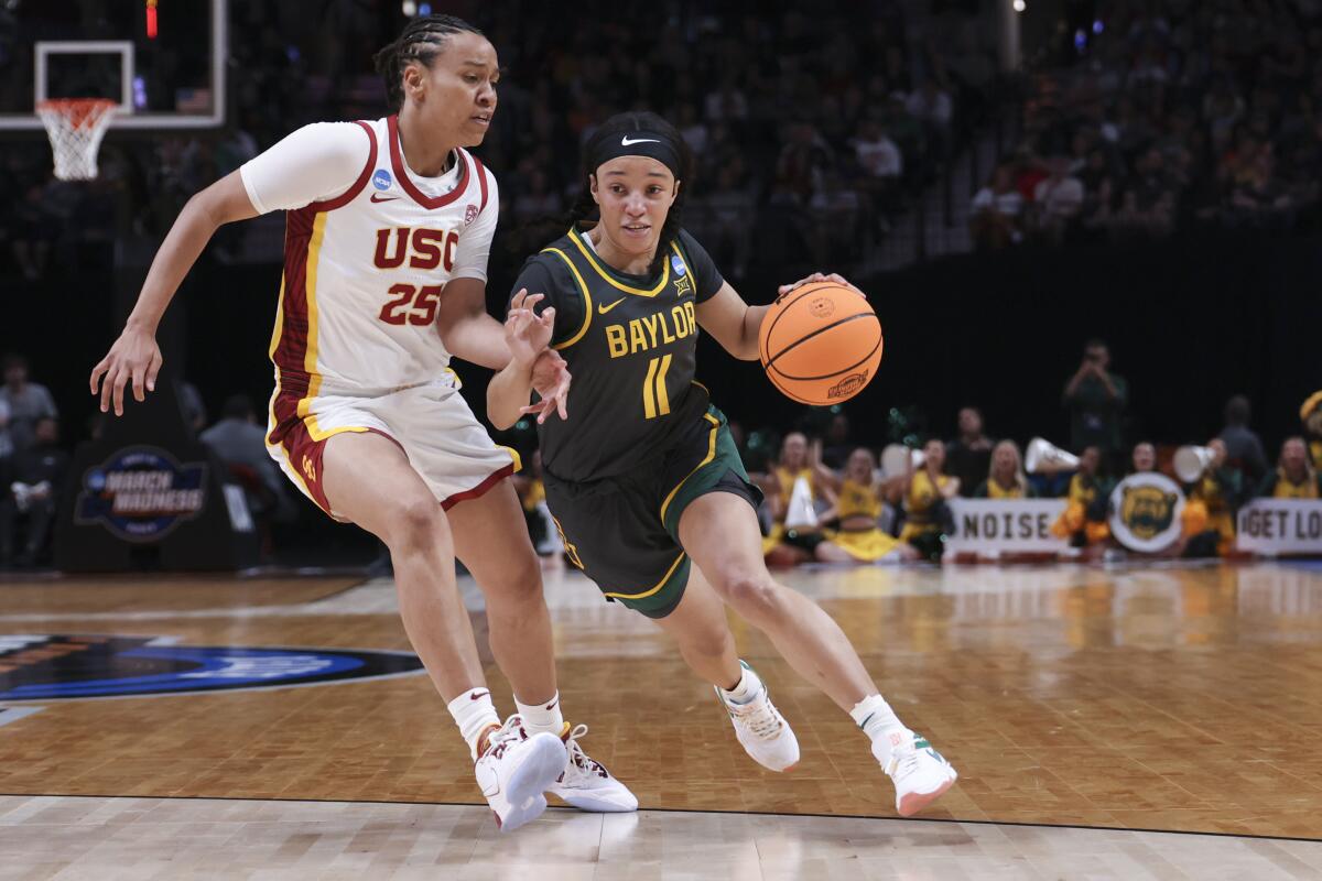 Baylor guard Jada Walker, right, drives to the basket in front of USC guard McKenzie Forbes during the first half.