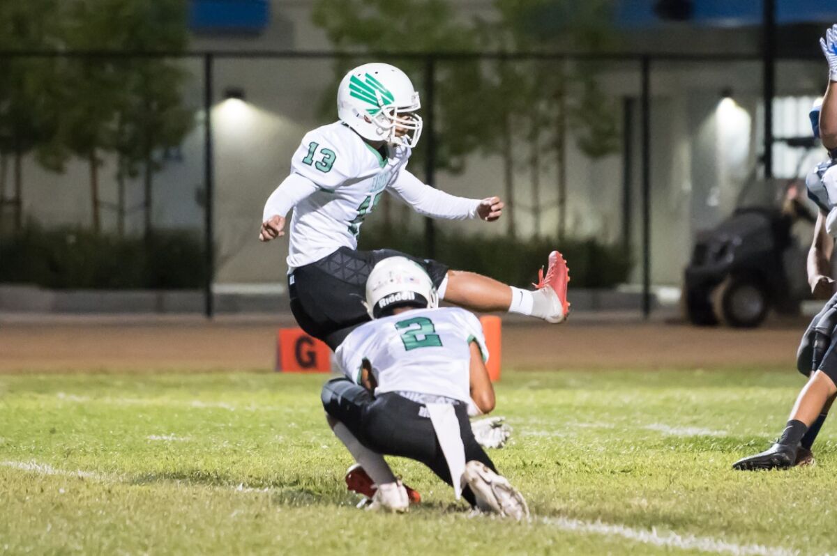 Eagle Rock attempts an extra point during a football game.