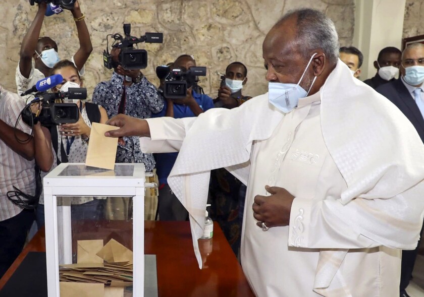Djibouti's President Ismael Omar Guelleh casts his vote in the capital Djibouti city, Djibouti Friday, April 9, 2021. The Horn of Africa country of Djibouti is going to the polls on Friday as President Ismail Omar Guelleh seeks a fifth term in the small but strategically important nation home to military bases for the United States, China and others. (AP Photo)