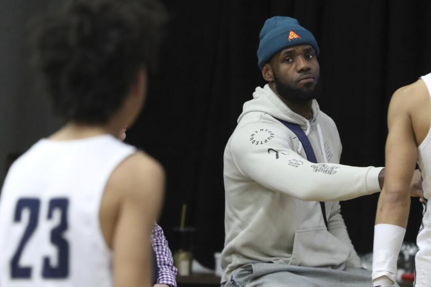 Los Angeles Lakers LeBron James congratulates Sierra Canyon players after their loss against against Paul VI in a high school basketball game at the Hoophall Classic, Monday, January 20, 2020, in Springfield, MA. (AP Photo/Gregory Payan)