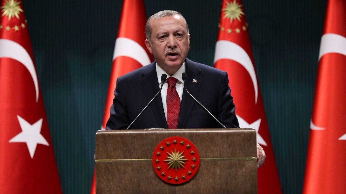 Turkish President Recep Tayyip Erdogan speaks at a news conference in Ankara on April 18, 2018.