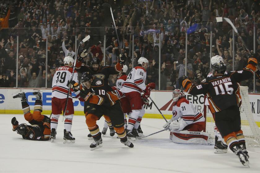 Cory Perry (10) celebrates after scoring the game-tying goal against the Carolina Hurricanes with 4:08 left in the third period at Honda Center. The Ducks beat the Hurricanes in overtime, 5-4.