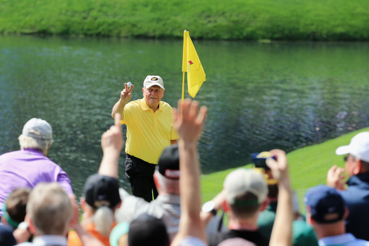 Jack Nicklaus celebrates a hole-in-one on the fourth hole of the Par 3 contest Wednesday before the start of the Masters at Augusta National Golf Club.