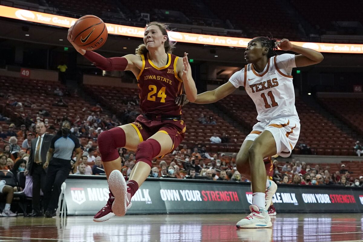 Iowa State guard Ashley Joens (24) drives to the basket against Texas guard Joanne Allen-Taylor (11) during the first half of an NCAA college basketball game, Wednesday, Feb. 16, 2022, in Austin, Texas. (AP Photo/Eric Gay)