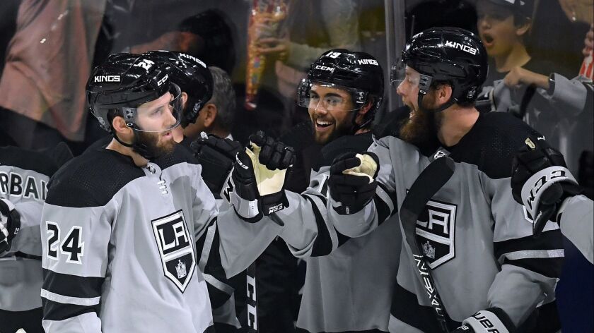 Derek Forbort (24) of the Kings celebrates his goal with teammates to take a 4-1 lead over the Vegas Golden Knights during the third period.