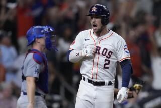 Houston Astros' Alex Bregman celebrates after hitting a walk-off home run during the ninth inning of a baseball game against the Los Angeles Dodgers, Saturday, July 27, 2024, in Houston. (AP Photo/Kevin M. Cox)
