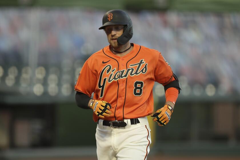 The Giants' Hunter Pence rounds the bases after homering against the Athletics on Aug. 14, 2020.