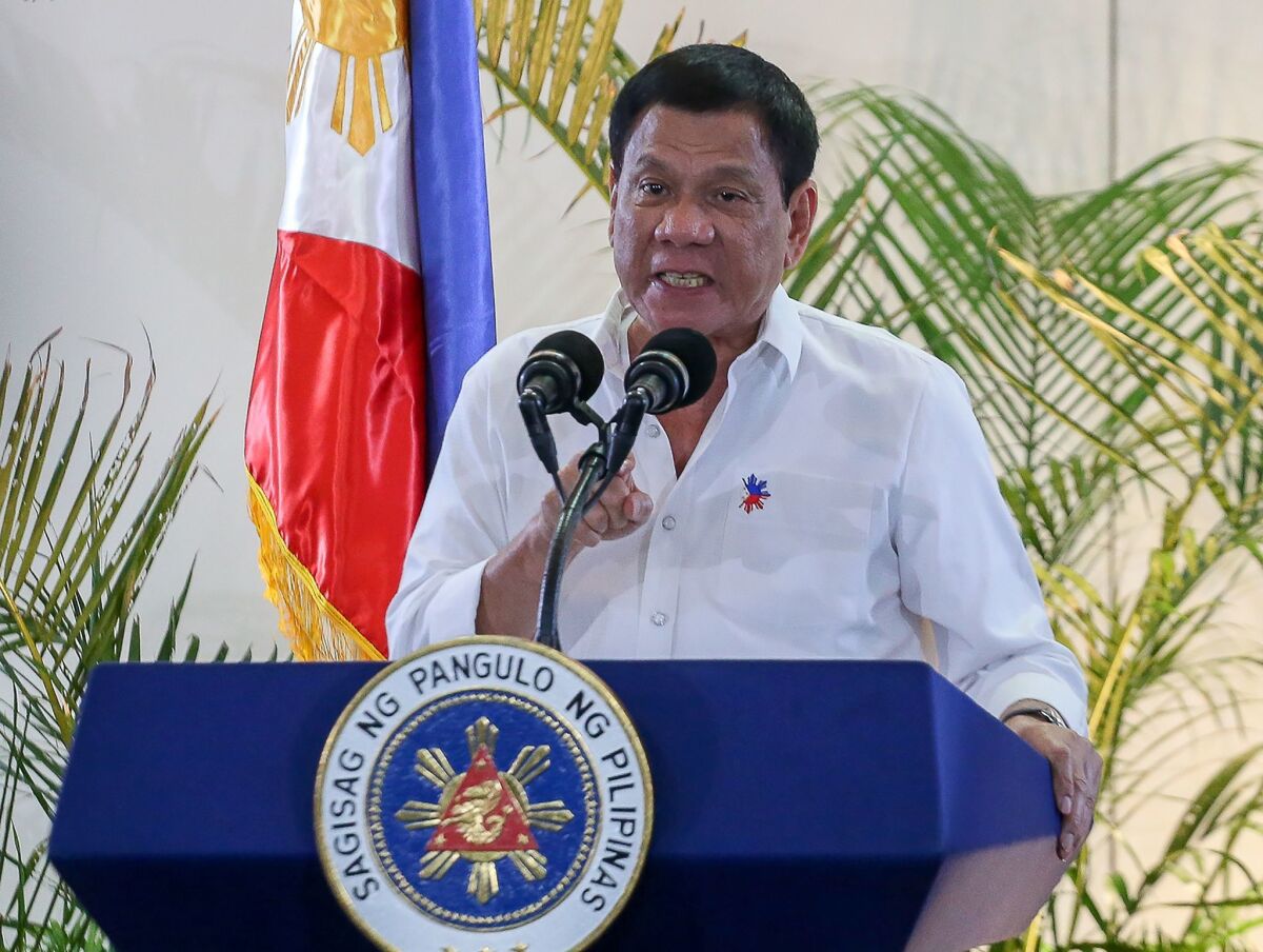 Philippine President Rodrigo Duterte speaks at a news conference a day after he boasted that he had killed criminals.
