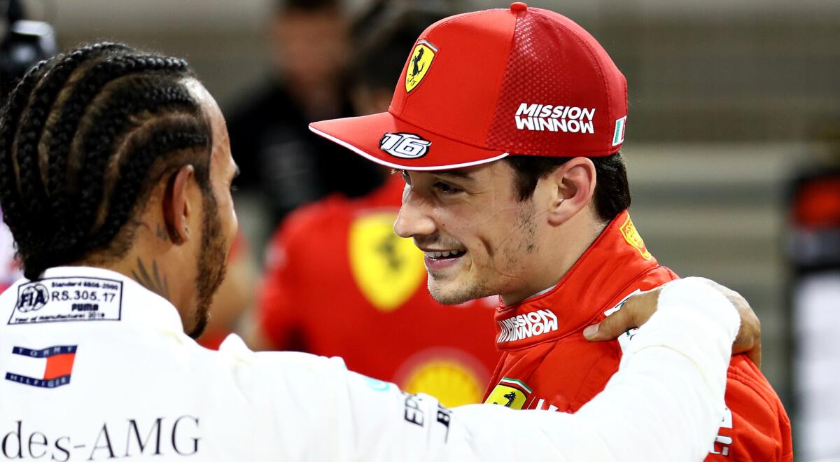Ferrari driver Charles Leclerc is congratulated by Mercedes driver Lewis Hamilton after winning pole position at the Bahrain Grand Prix on Saturday.