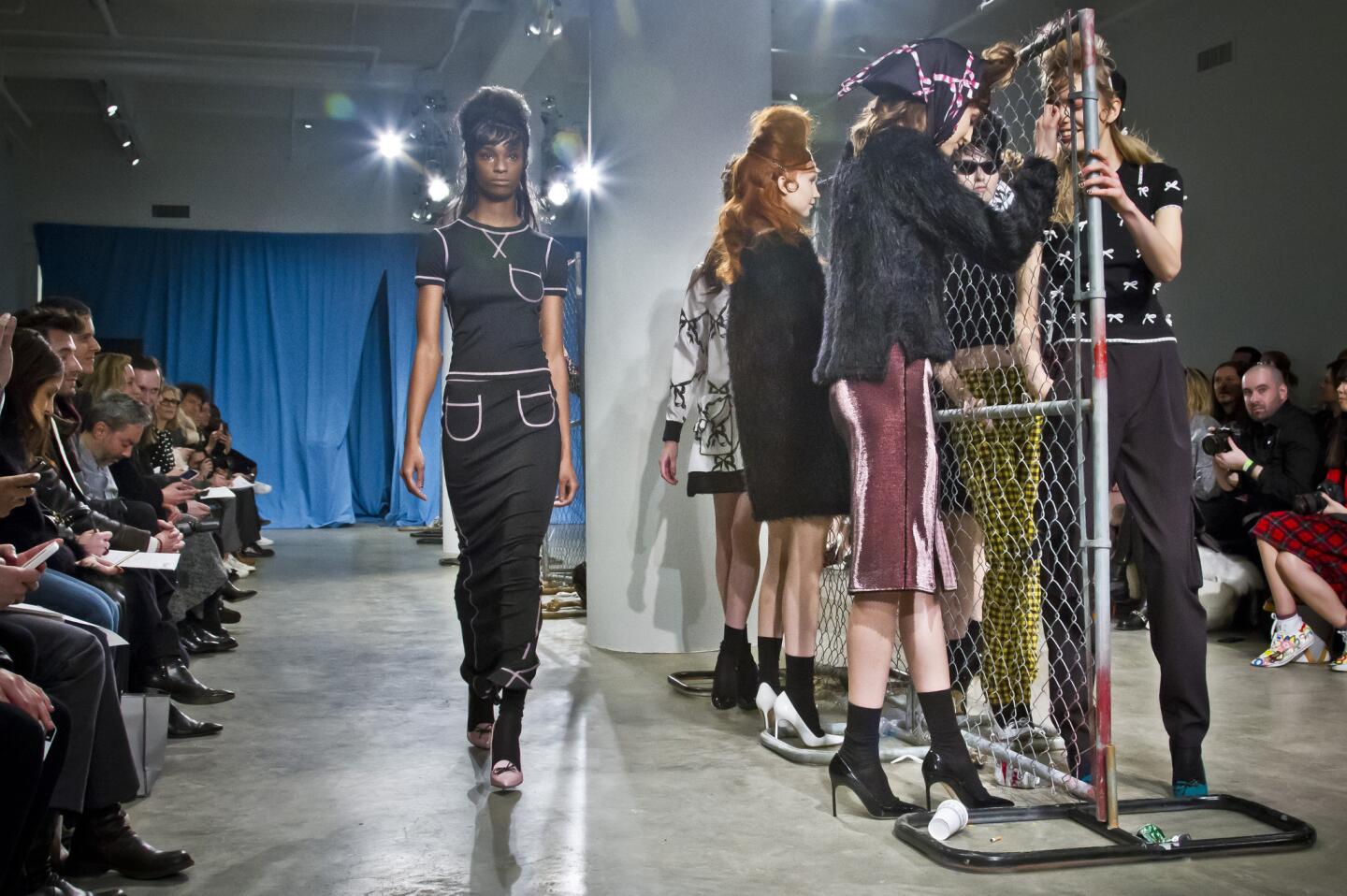 A chain-link fence keeps bad girls apart at the Adam Selman show.