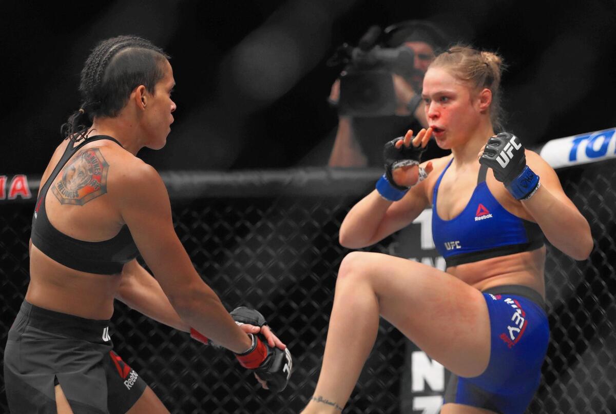 Glendale Fighting Club’s Ronda Rousey, right, returned to the Octagon to face Amanda Nunes, left, of Brazil in their UFC women's bantamweight championship bout during UFC 207. Rousey lost via a TKO.