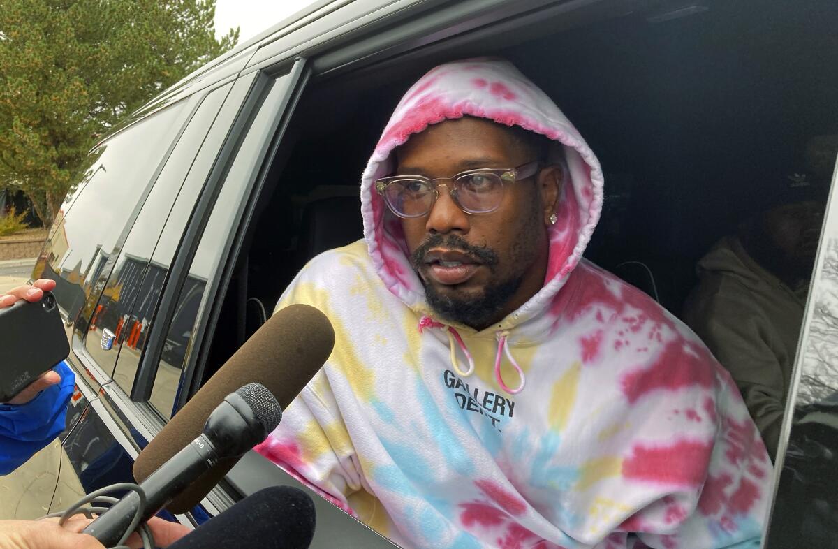 Former Denver linebacker Von Miller stops to talk to reporters outside the  Broncos headquarters after he was traded.