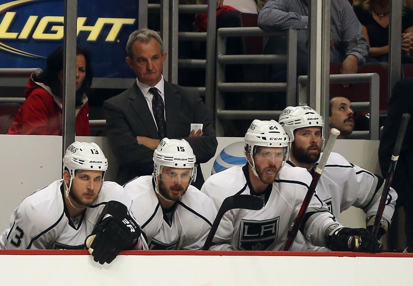 Coach Darryl Sutter and Kings players watch play in the third period of a 2-1 loss to the Blackhawks in Game 1 of the Western Conference finals on Saturday at United Center in Chicago.