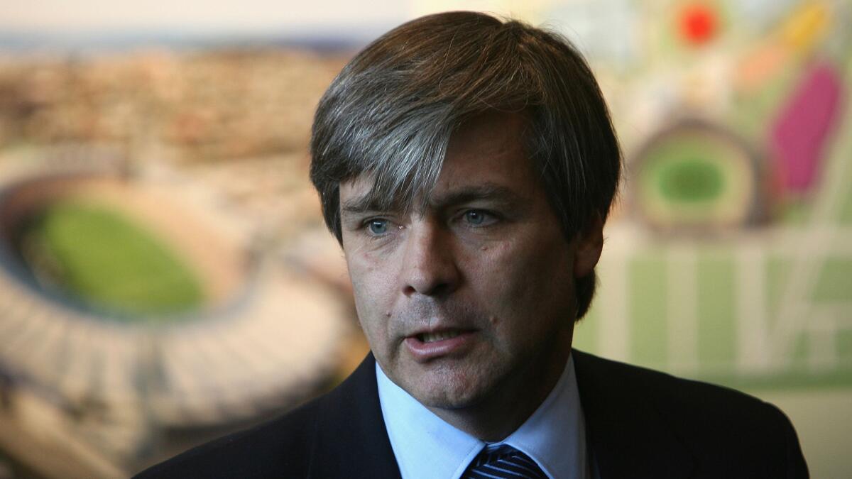 Harold Mayne-Nicholls, the former head of the FIFA inspection team, speaks during an inspection tour in Melbourne, Australia, in July 2010. FIFA's ethics committee has banned him from "any kind of football-related activity at national and international level" for seven years, but gave no reason for the decision.