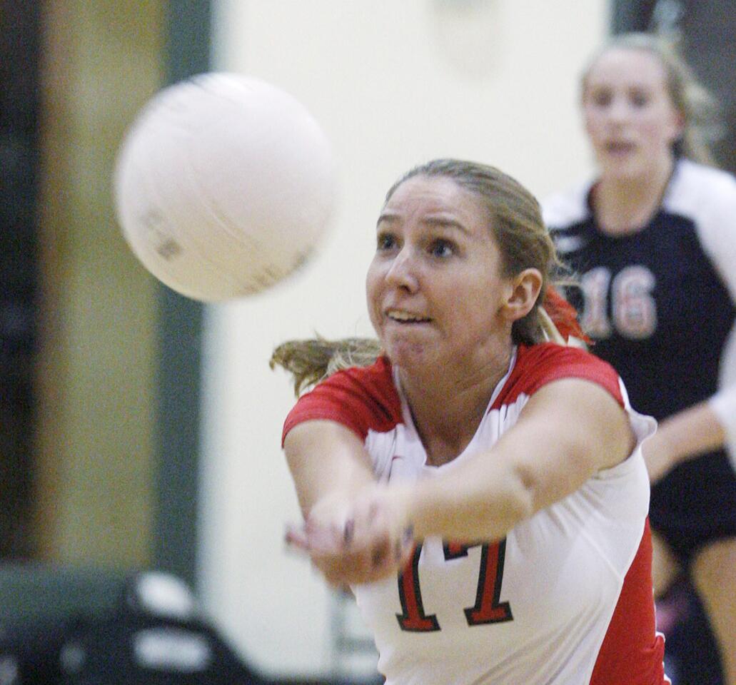 Flintridge Sacred Heart's Colleen Degnan, off a tipped block, dives to bump the ball into play against Louisville in a Mission League girls volleyball match at FSHA in La Canada Flintridge on Tuesday, October 23, 2012.