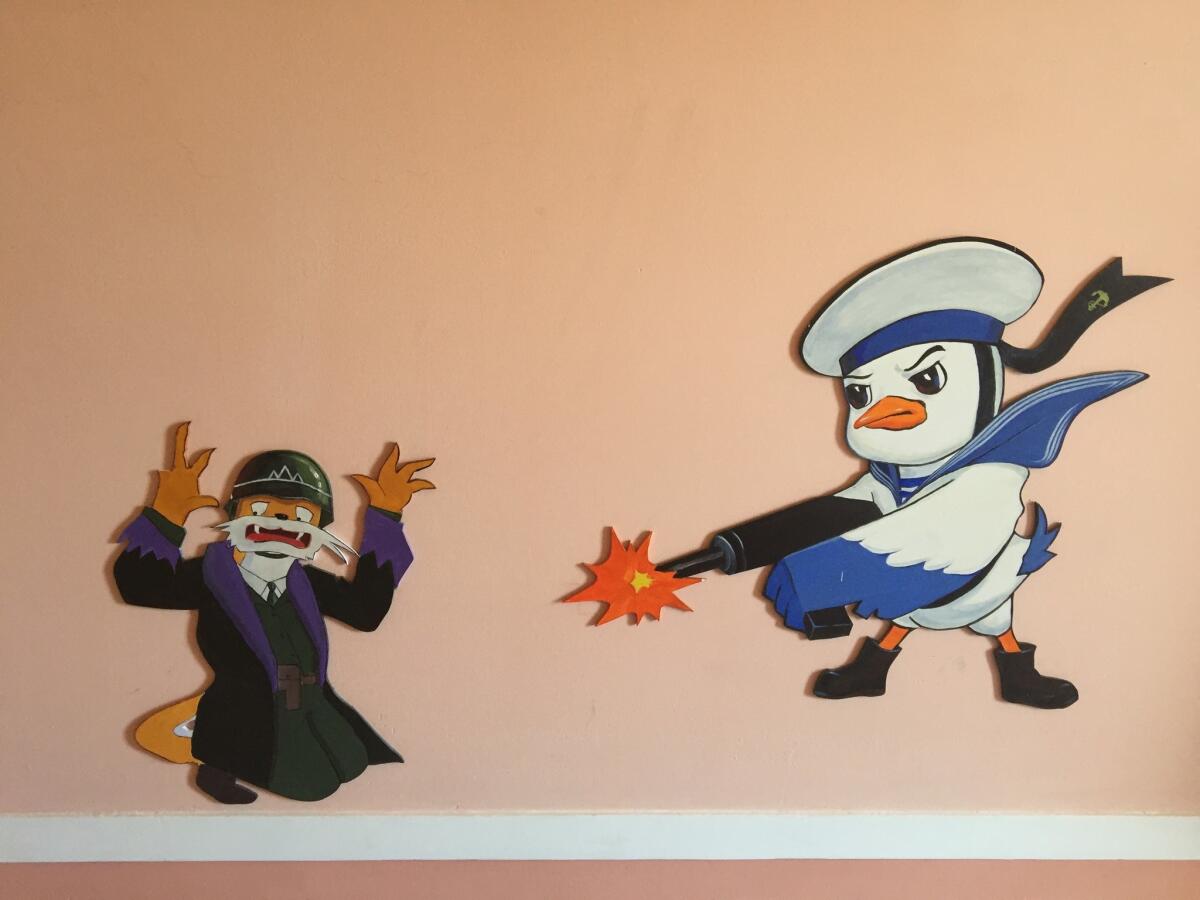 A duck character from the animated series "Squirrel and Hedgehog" is featured on the wall of the Changchon nursery school. (Julie Makinen / Los Angeles Times)