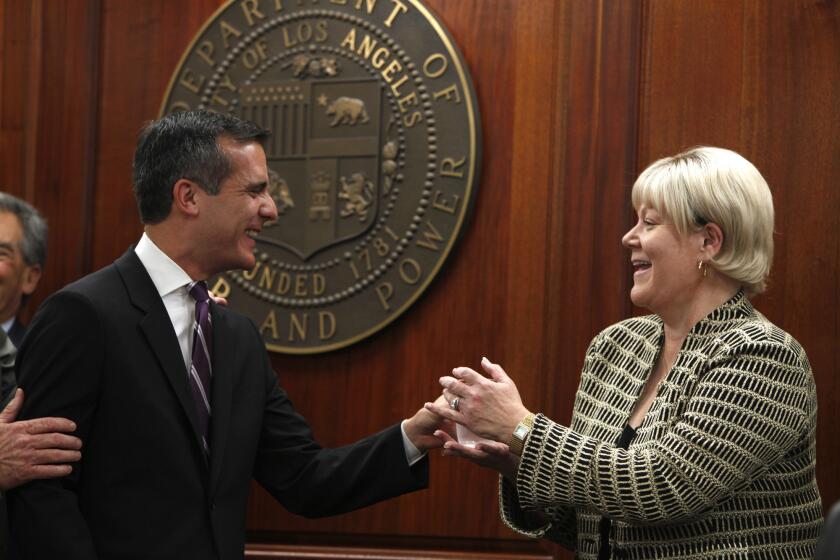 A file photo shows Mayor Eric Garcetti and Marcie Edwards at a news conference introducing her as the new general manager of the Department of Water and Power.
