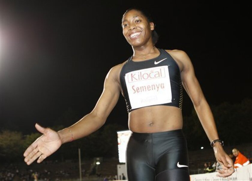 South Africa's Caster Semenya celebrates after winning the women's 800m event during the Notturna di Milano International Athletics meeting in Milan, Italy, Thursday, Sept 9, 2010. (AP Photo/Antonio Calanni)