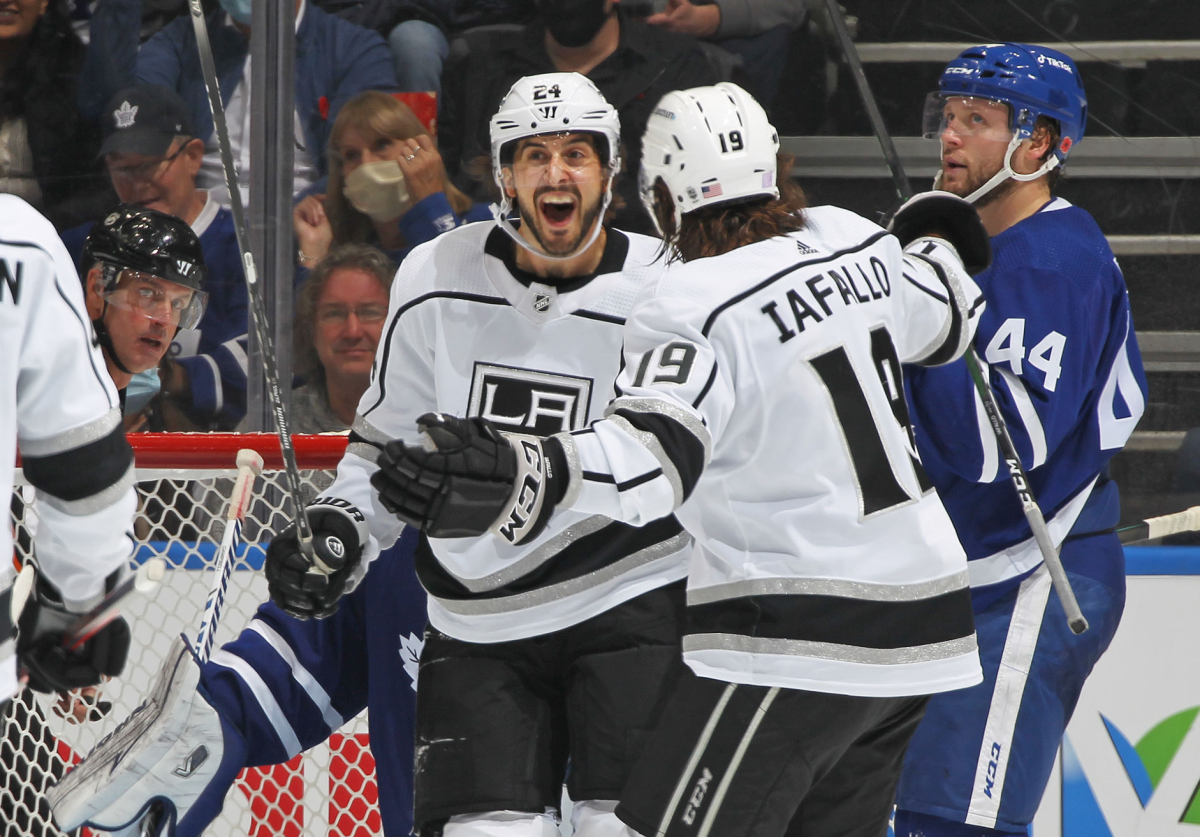 Kings forward Phillip Danault, center, celebrates with forward Alex Iafallo.