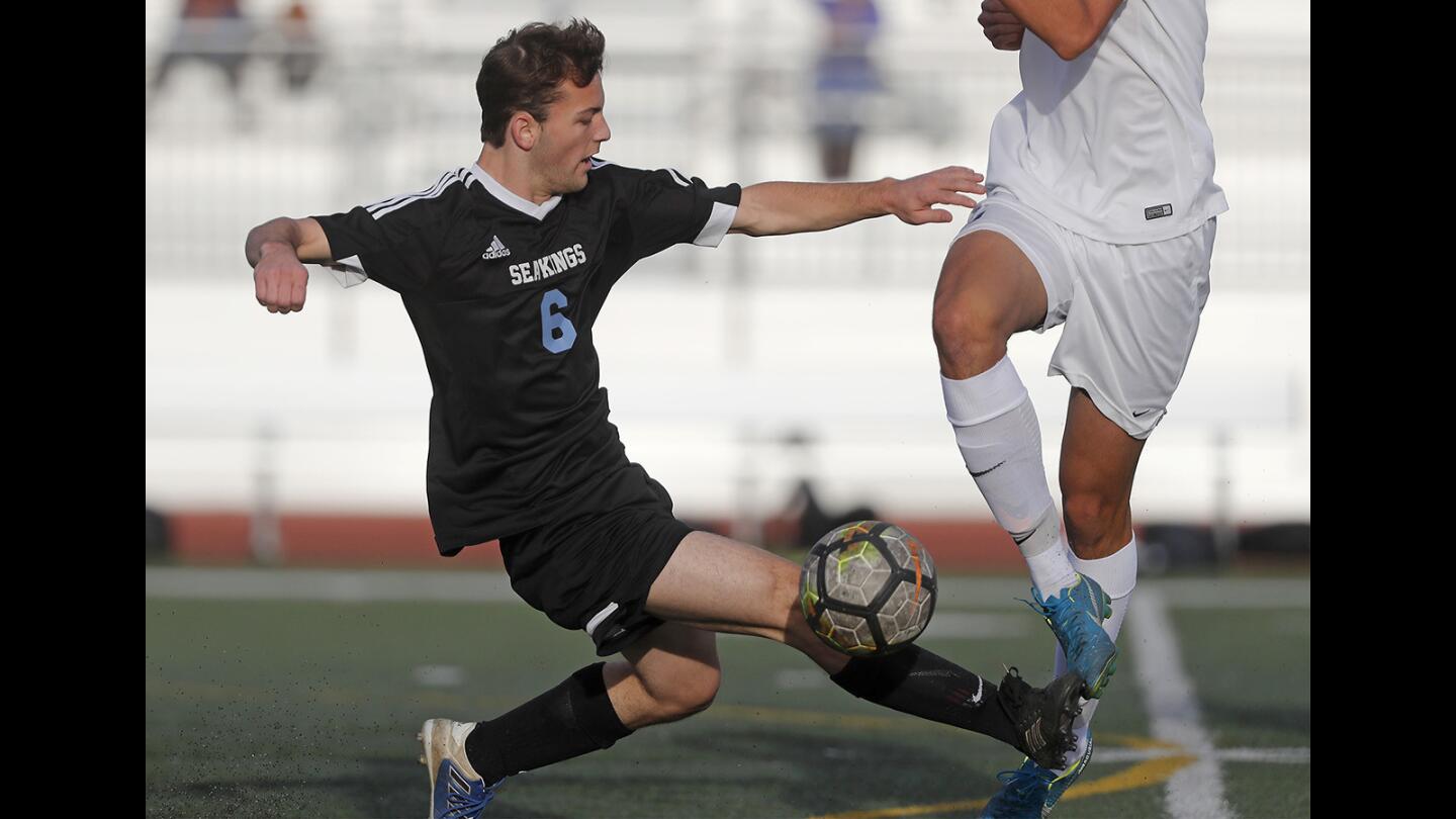 Corona del Mar High's Max Righeimer (6) competes against University during the first half in a Pacific Coast League game on Tuesday in Irvine.