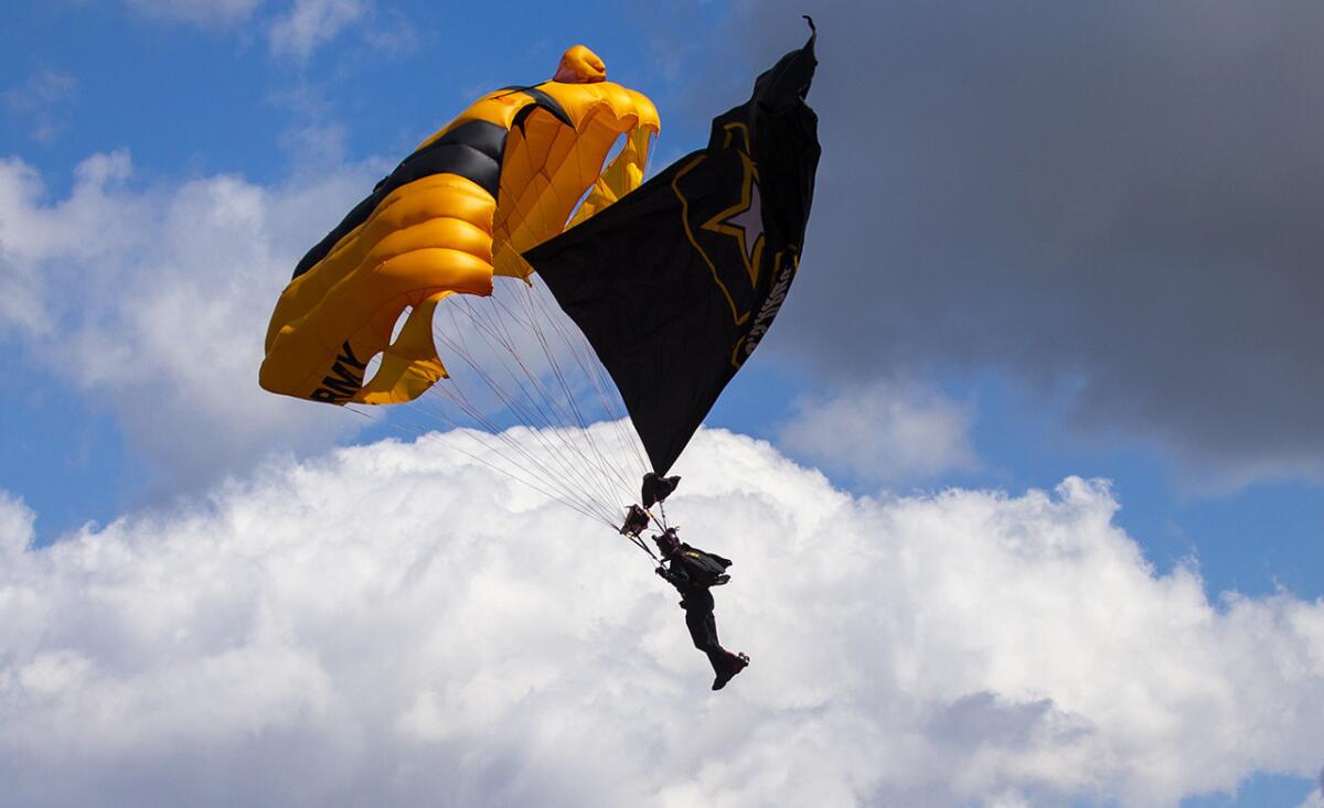 A member of U.S. Army Golden Knights parachutes into Dodger Stadium prior to Thursday's game against the Arizona Diamondbacks.