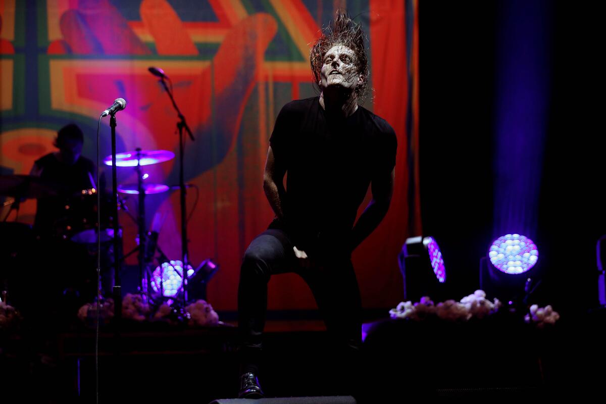 George Clarke onstage at the Wiltern with his metal band Deafheaven.