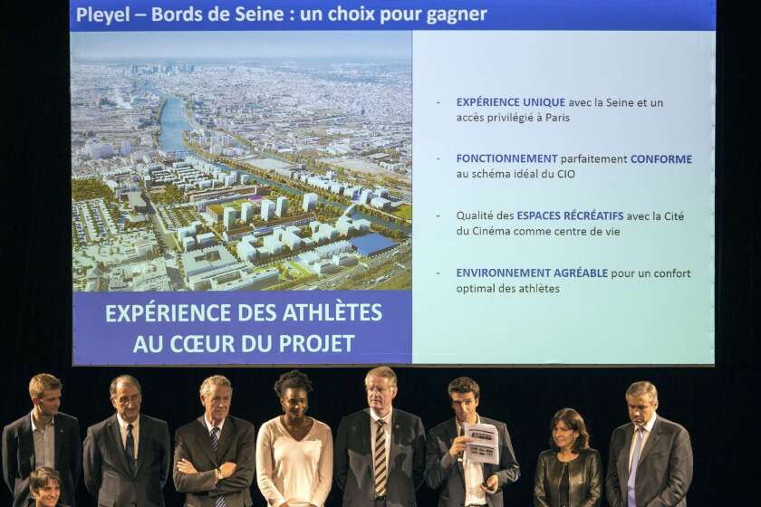 Tony Estanguet, third from right, announces at a Nov. 5 news conference the site for the Olympic Village if Paris wins the 2024 Olympics. The former Olympic athlete and co-president of the city's bid will lead a delegation to a workshop at International Olympic Committee headquarters in Switzerland this week.