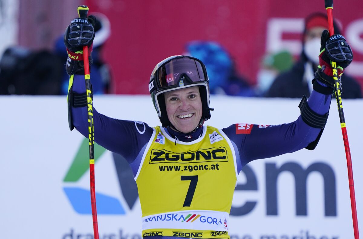 Sweden's Sara Hector celebrates at the finish area after winning the alpine ski, World Cup women's giant slalom in Kranjska Gora, Slovenia, Saturday, Jan. 8, 2022. (AP Photo/Pier Marco Tacca)