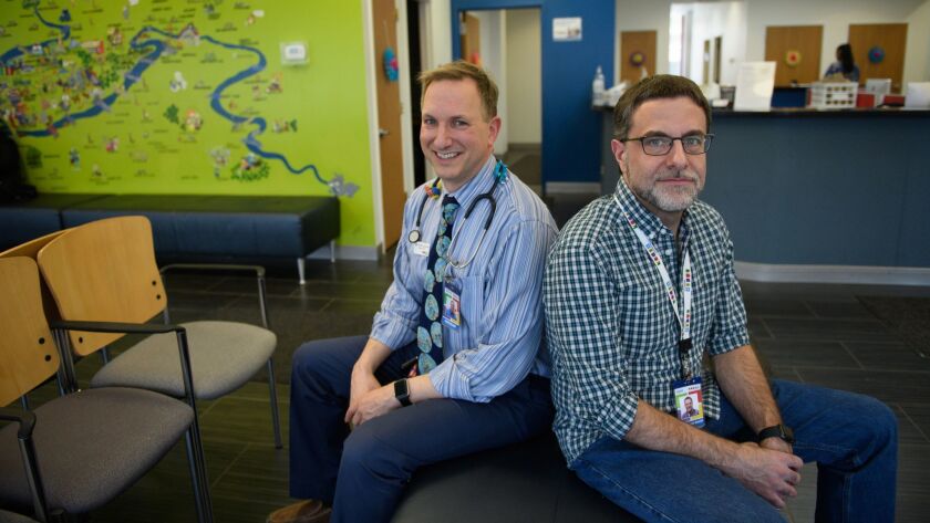 Dr. Todd Wolynn, left, and Chad Hermann, the communications director for Wolynn's pediatrics practice in Pittsburgh, have been speaking at conferences trying to encourage doctors to fight back on the subject of immunizations.