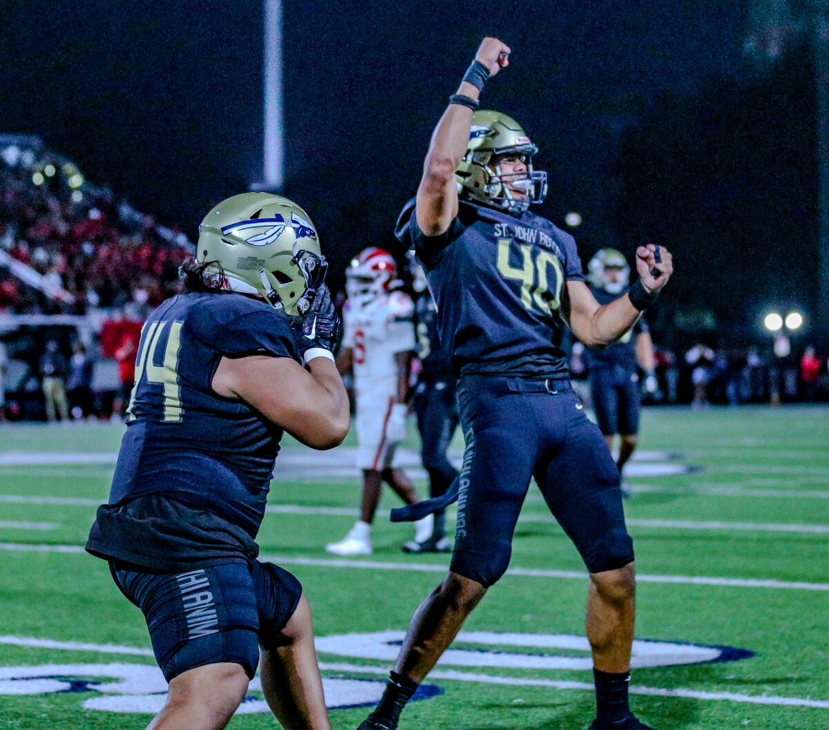 St. John Bosco defensive linemen Max Amasio (left) and Epi Sitanilei each had sacks against Mater Dei.