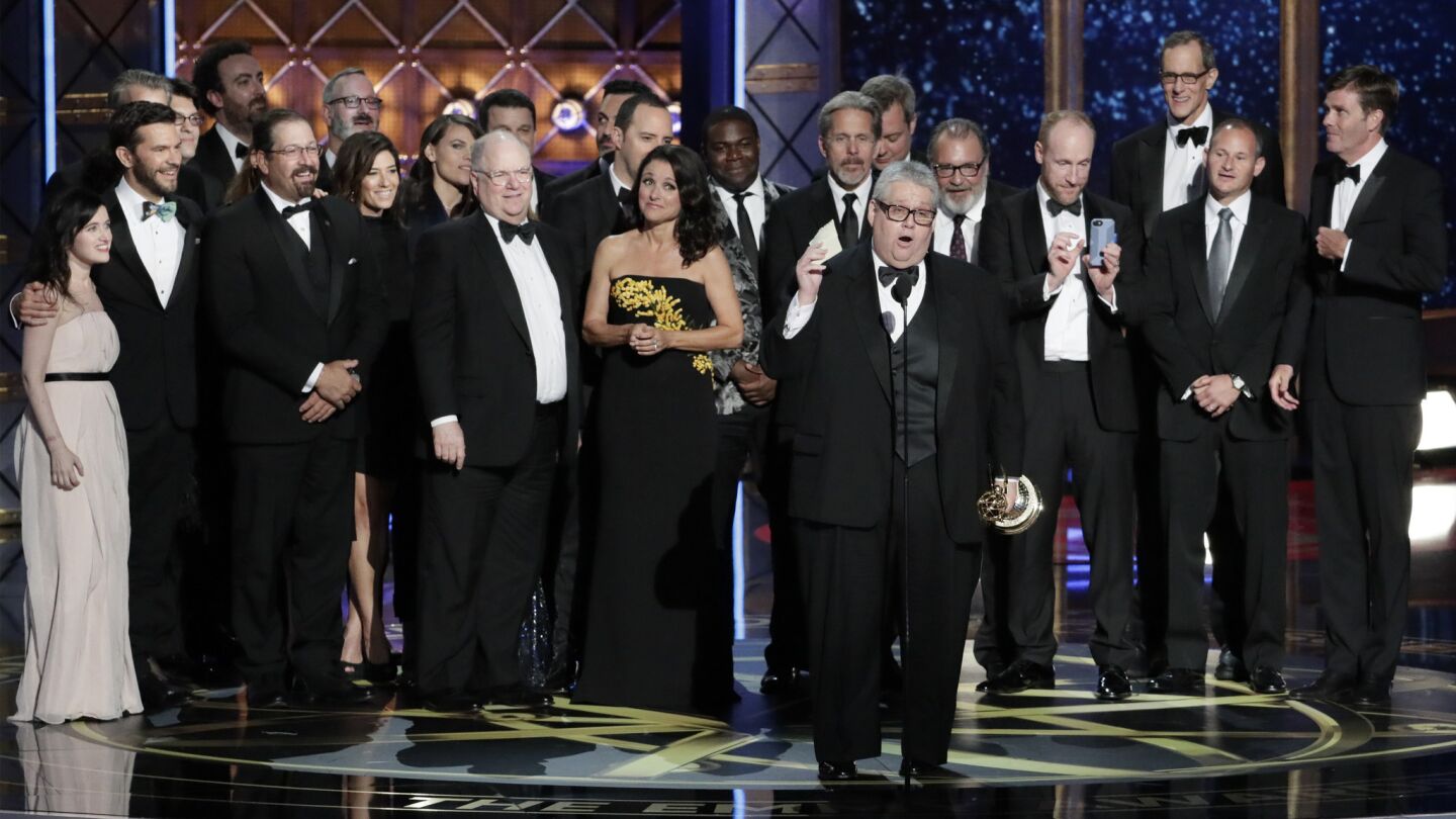Cast and crew of "Veep" accept the comedy series award onstage.