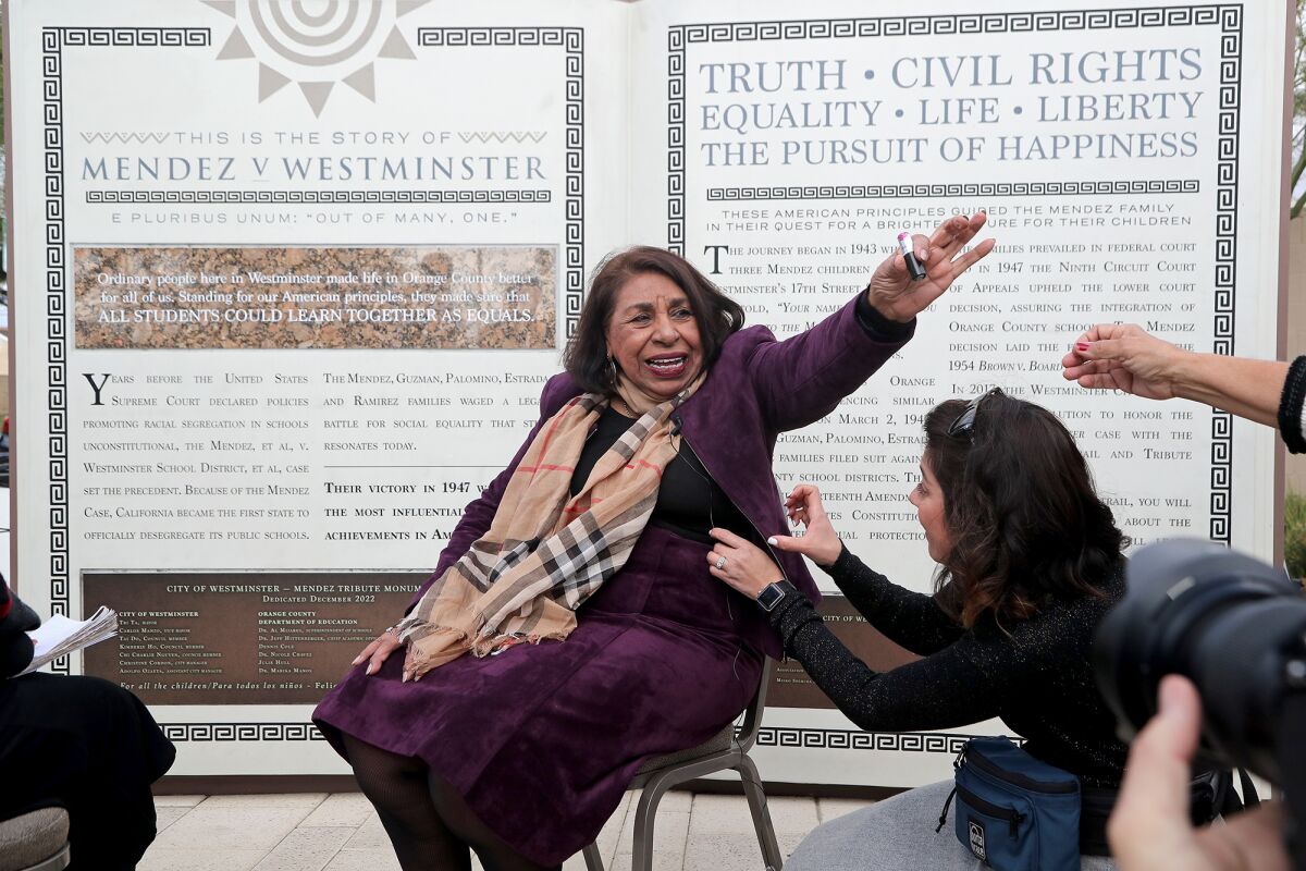 Activist Sylvia Mendez waves during a grand-opening ceremony on Thursday for Mendez Tribute Monument Park in Westminster.