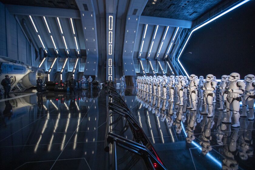 ANAHEIM, CALIF. -- THURSDAY, JANUARY 16, 2020: 50 50 stormtroopers stand guard in the hangar bay of the First Order Star Destroyer as they usher the Resistance recruits to be interrogated during Star Wars: Rise of the Resistance Media Preview at the Disneyland Resort in Anaheim, Calif., on Jan. 16, 2020. Star Wars: Galaxy's Edge (Allen J. Schaben / Los Angeles Times)