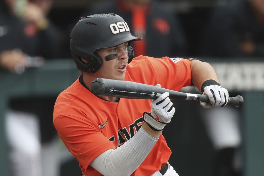 FILE -Oregon State's Justin Boyd bunts the ball during an NCAA baseball game against Stanford on Sunday, April 3, 2022, in Corvallis, Ore. The Guardians acquired outfielder Justin Boyd on Wednesday, Feb. 8, 2023 in a trade with the Cincinnati Reds for outfielder Will Benson. Boyd was Cincinnati’s 2nd round (73rd overall) pick in the 2022 MLB Draft out of Oregon State, where he batted a Pac-12-best .373 with 24 steals last season, earning NCBWA Second-Team All-American honors.(AP Photo/Amanda Loman, File)