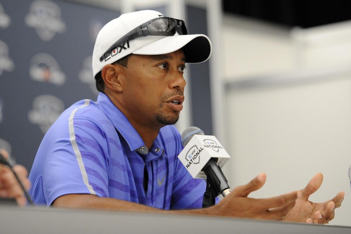 Tiger Woods told reporters Wednesday he plans to play in the British Open whether his left elbow is 100% or not.