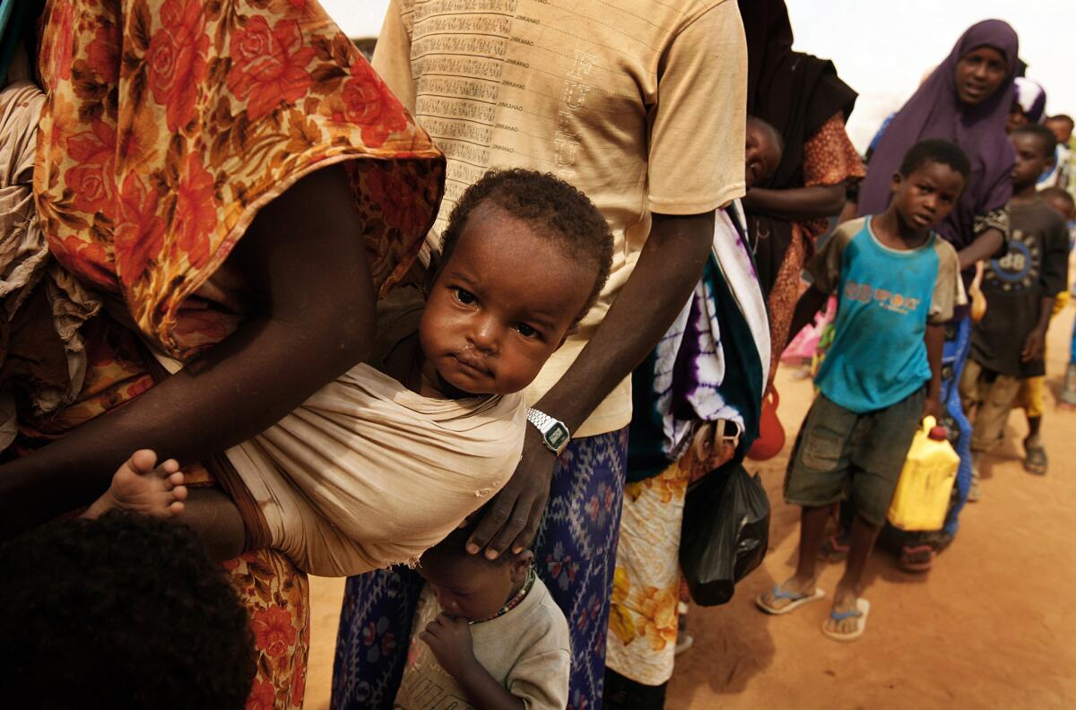 Refugees await entrance into Dadaab in 2009.