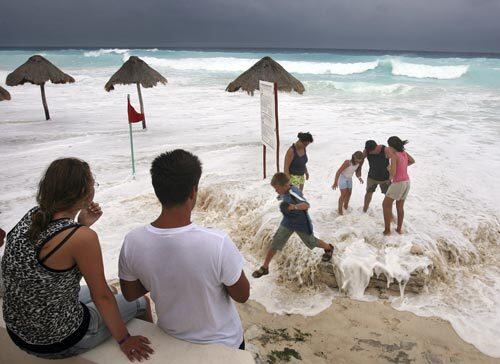 Tourists in Cancun, Mexico, on Monday as Hurricane Dean approaches.