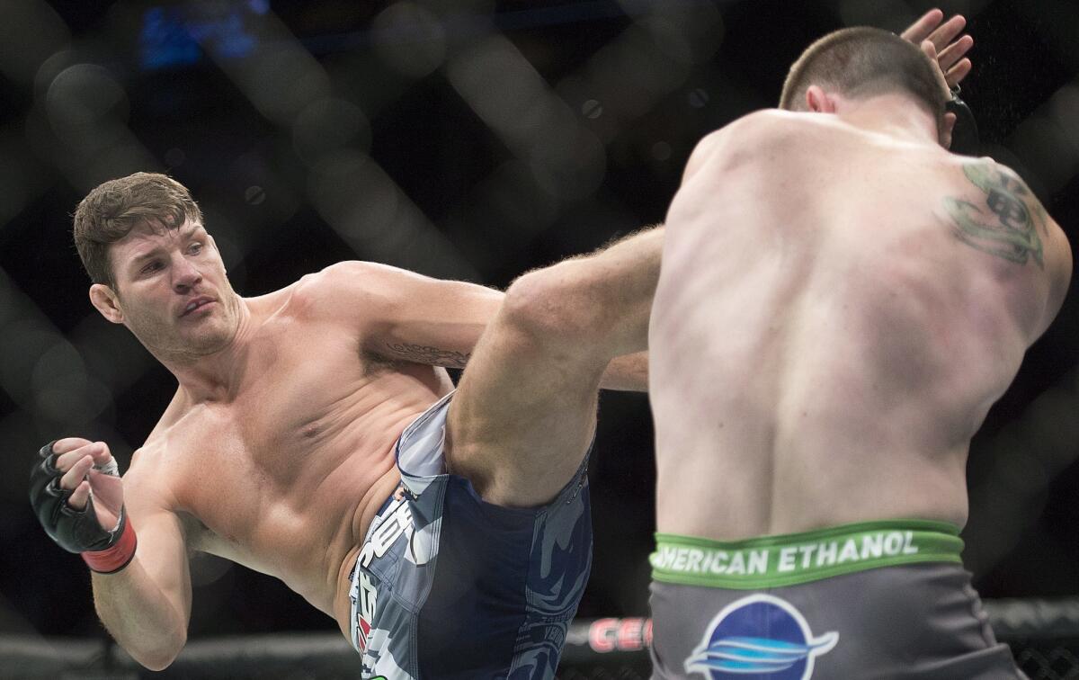 Michael Bisping, left, fighting C.B. Dollaway on April 25, is one of the many fighters not available for a UFC event originally scheduled for Jan. 21 in Anaheim.