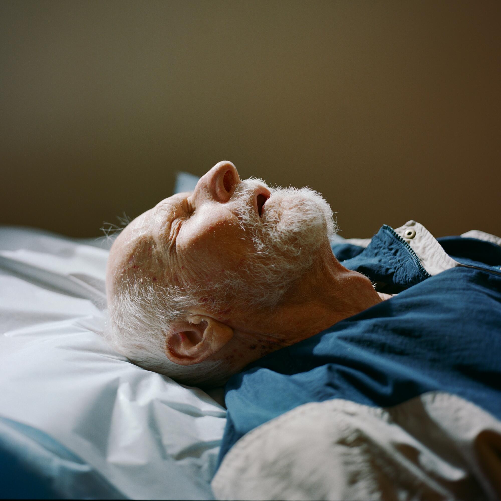 Andrzej lies down at a doctor's appointment at UCLA Health