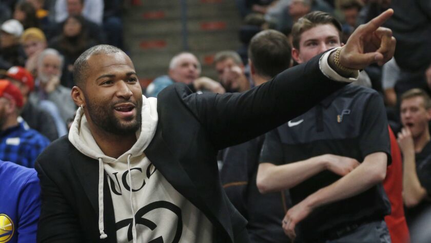 Warriors center DeMarcus Cousins points to Jazz fans during the first half of a game Dec. 19.