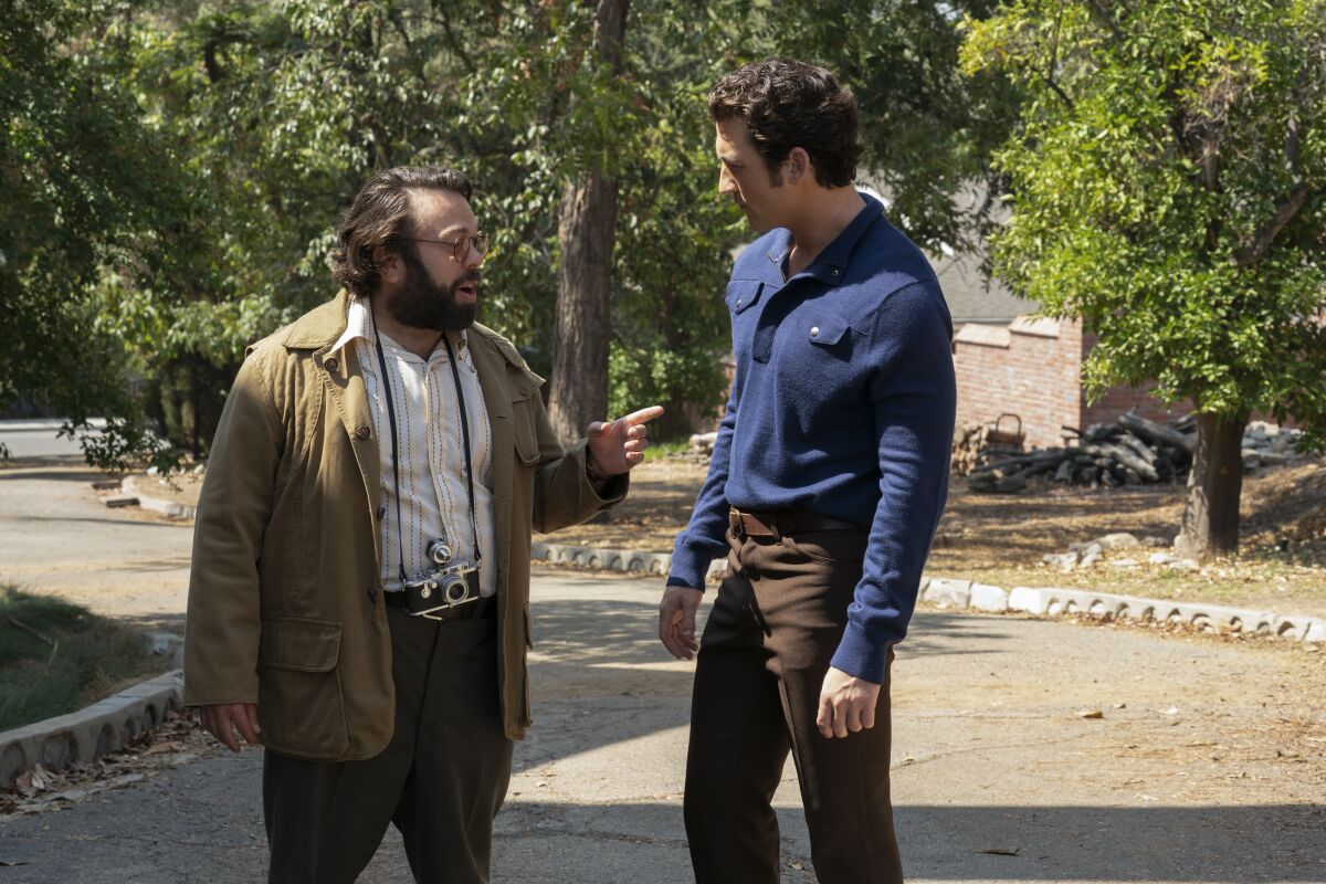 Two men in conversation outdoors