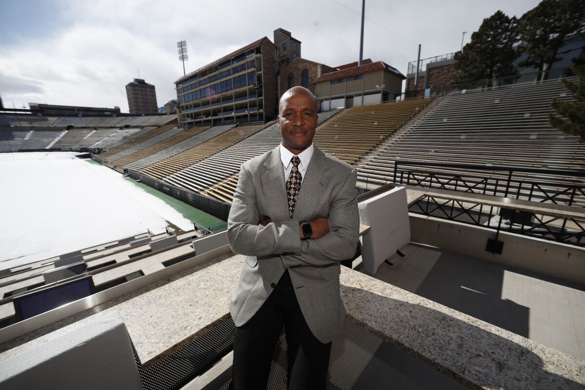 Colorado coach Karl Dorrell poses at Folsom Field.