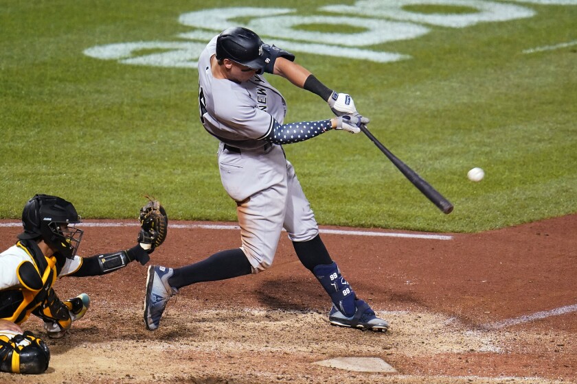 New York Yankees' Aaron Judge hits a grand slam off Pittsburgh Pirates relief pitcher Manny Banuelos during the eighth inning of a baseball game in Pittsburgh, Wednesday, July 6, 2022. (AP Photo/Gene J. Puskar)