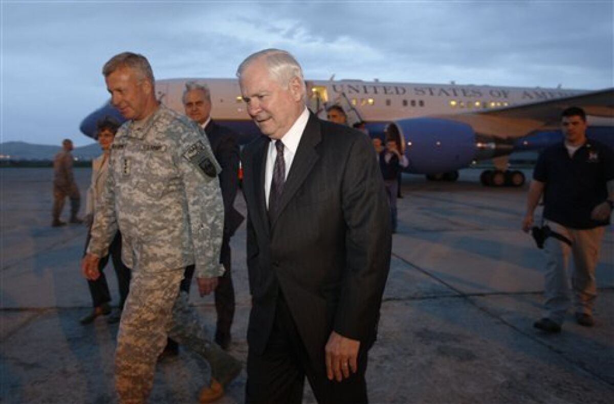 U.S. Secretary of Defense Robert Gates, right, walks with Gen. David McKiernan, commander of the U.S. Forces in Afghanistan, upon Gates' arrival in Kabul, on Wednesday May 6, 2009. (AP Photo/Jason Reed, Pool)