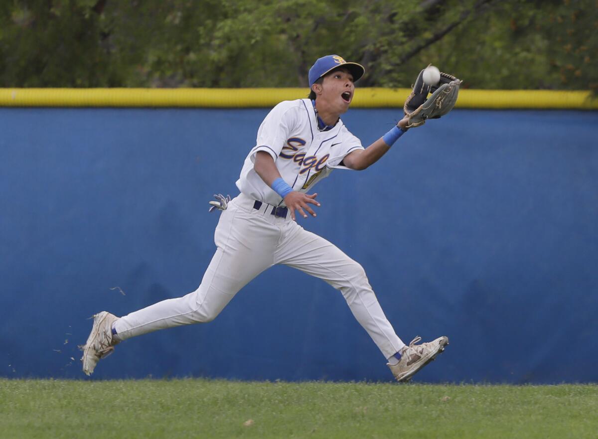San Pasqual right fielder Christian Sanchez catches a run during the first inning.