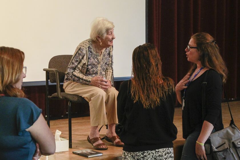 Rose Schindler (2nd from left), 89, who is a holocaust survivor, speaks to audience members at Ramona High School after her presentation on October 23, 2019 in Ramona, California.