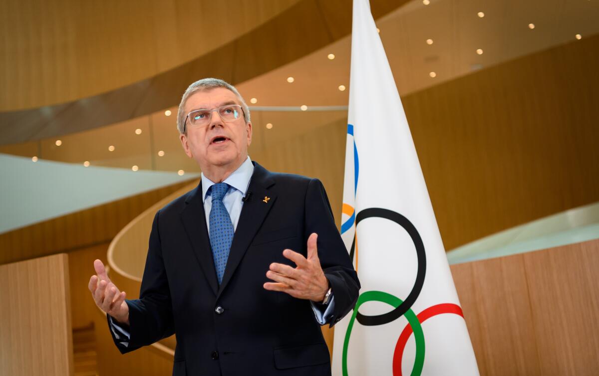 International Olympic Committee President Thomas Bach delivers a statement on the COVID-19 situation during a meeting of the executive board at IOC headquarters in Lausanne, Switzerland, on Tuesday.