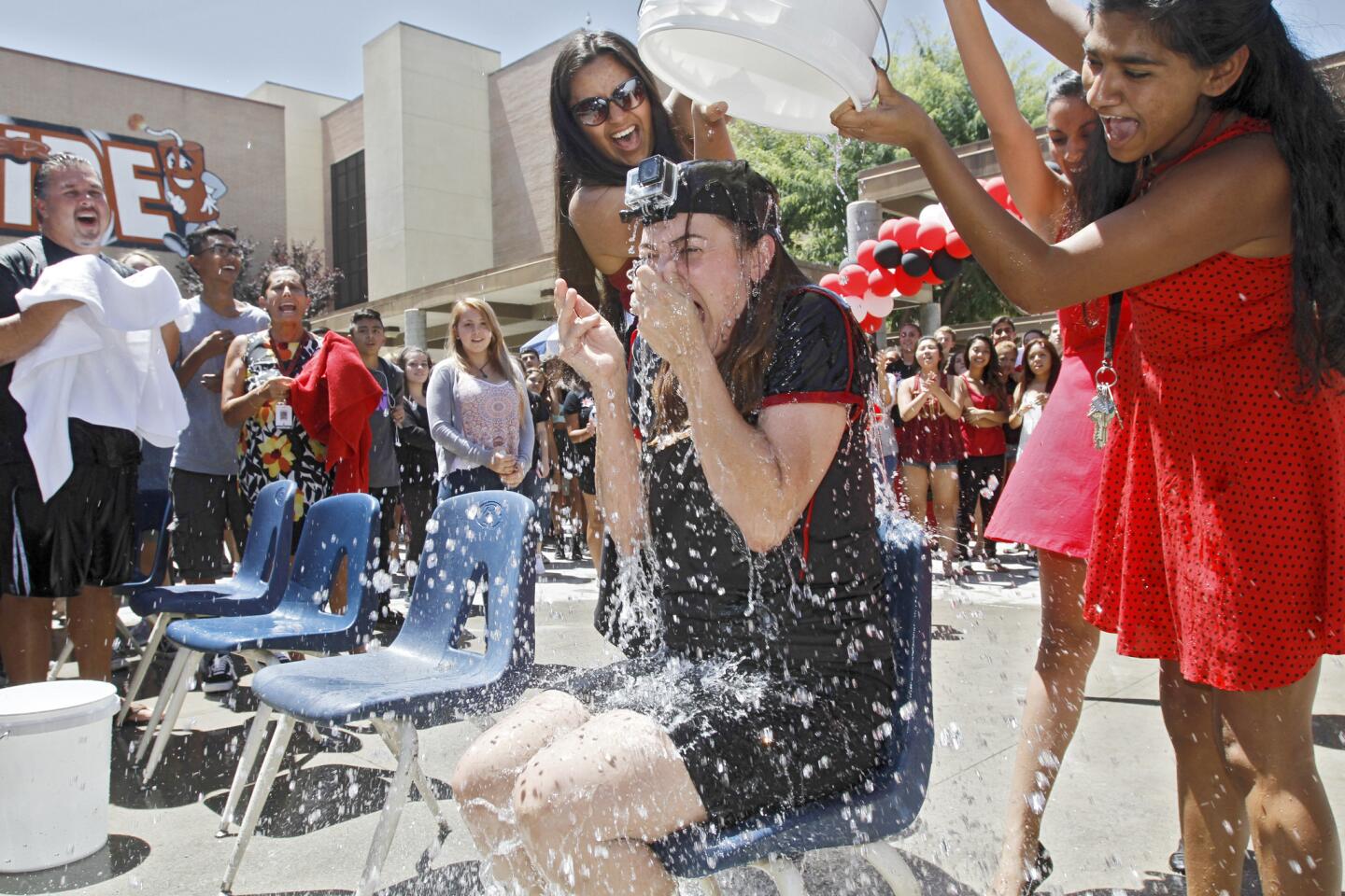 Glendale High School principal Dr. Monica Makiewicz takes a full bucket of ice water during the ASB-hosted Ice Bucket Challenge at the Glendale school on Friday, Aug. 15, 2014. The challege raises funds for the ALS Foundation.